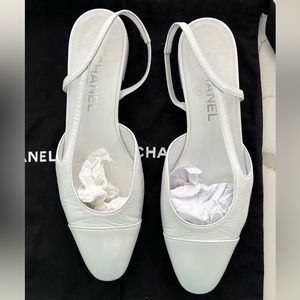 White patent leather flat slingbacks